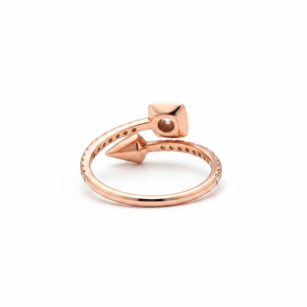 Maison Leininger 18K rose gold ring with diamonds, featuring a modern bypass design with a square-cut diamond and a pointed end.